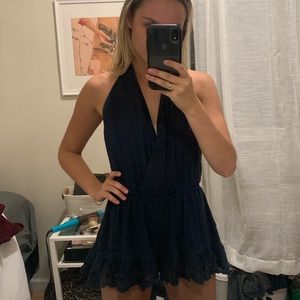 NAVY HALTER TOP FRILLY ROMPER. SIZE SMALL